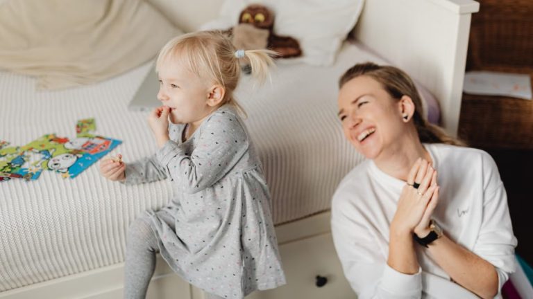 Joyful mother and daughter bonding during playtime indoors. Captured in a cozy home environment.
